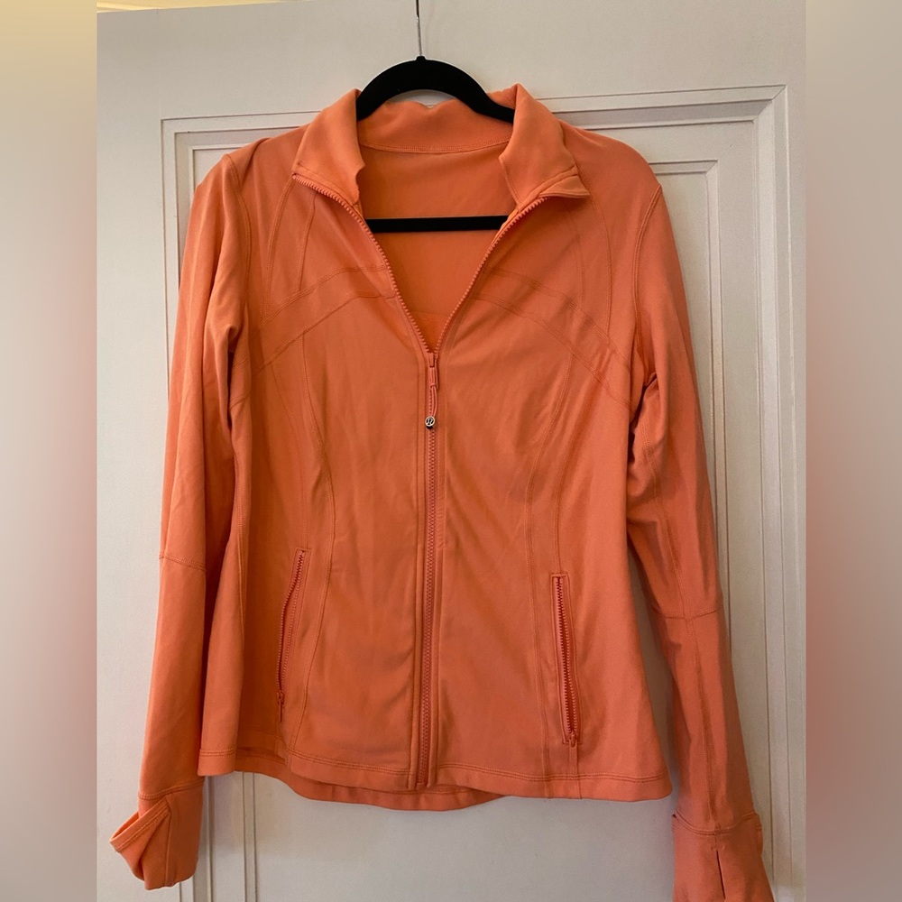 Lululemon brand light orange jacket size 8 to 10.